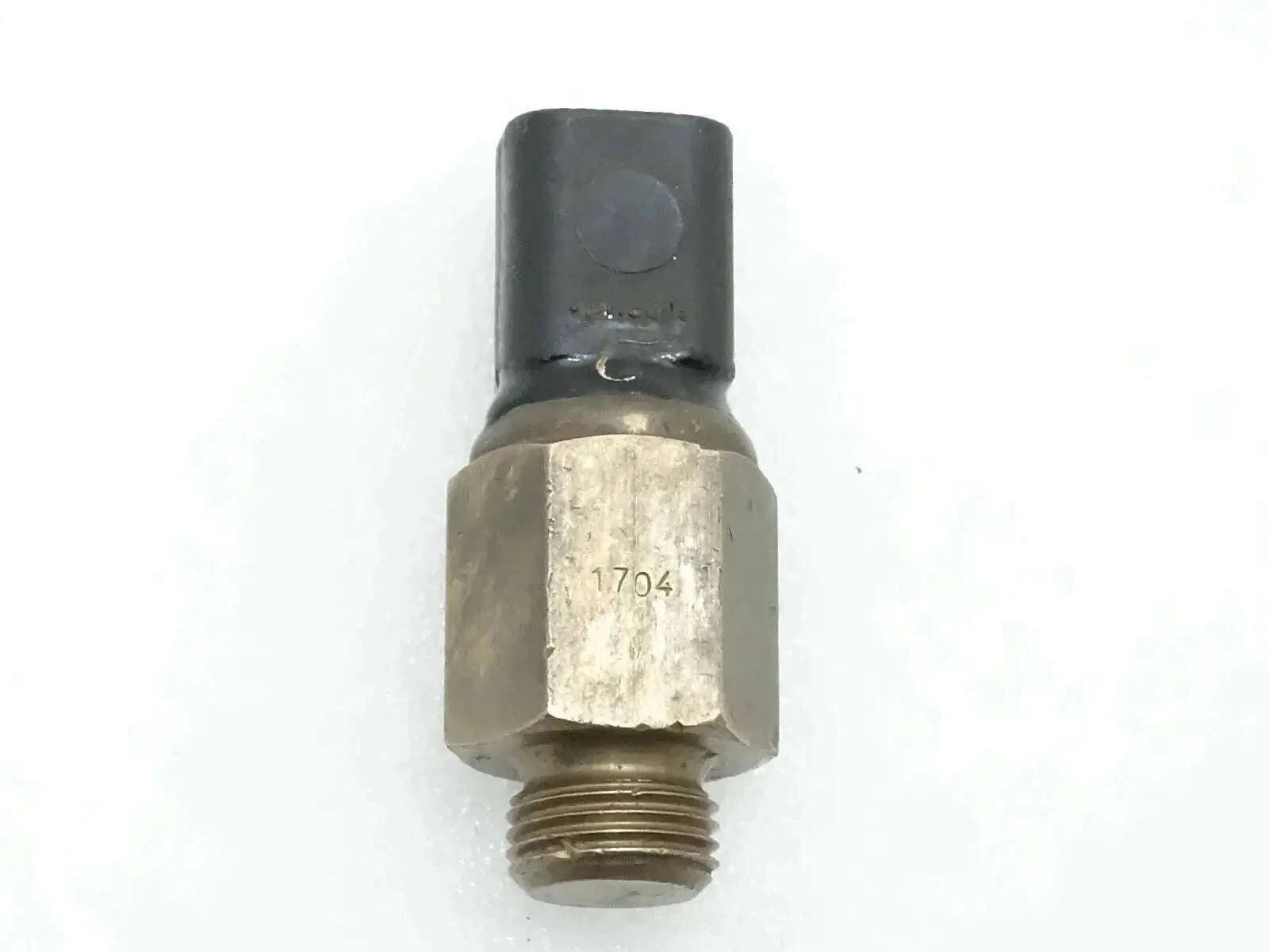 Oil temperature switch with threaded metal body and black sensor tip