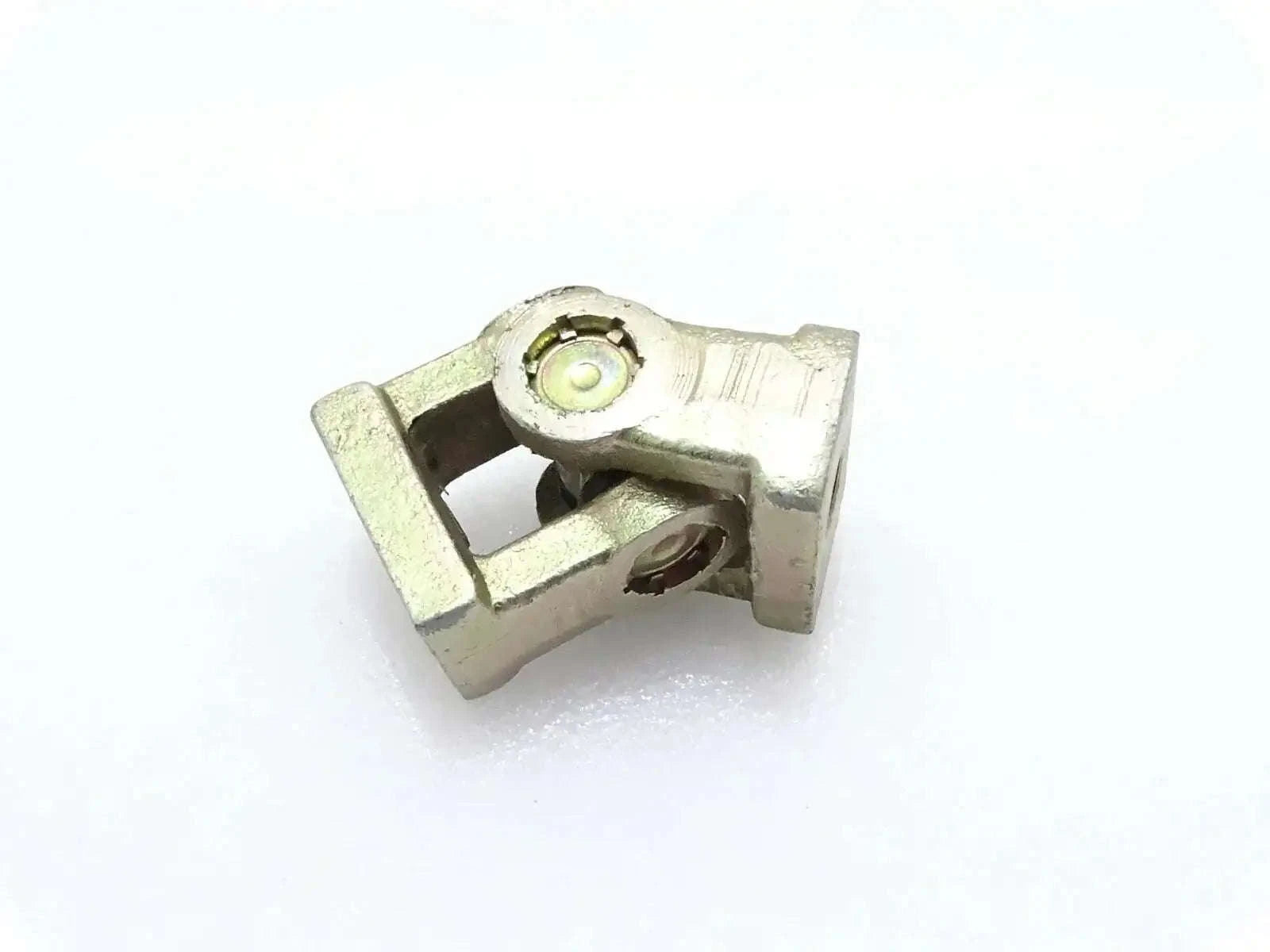 Universal joint yoke with grease fitting, metal housing, for backhoe linkage