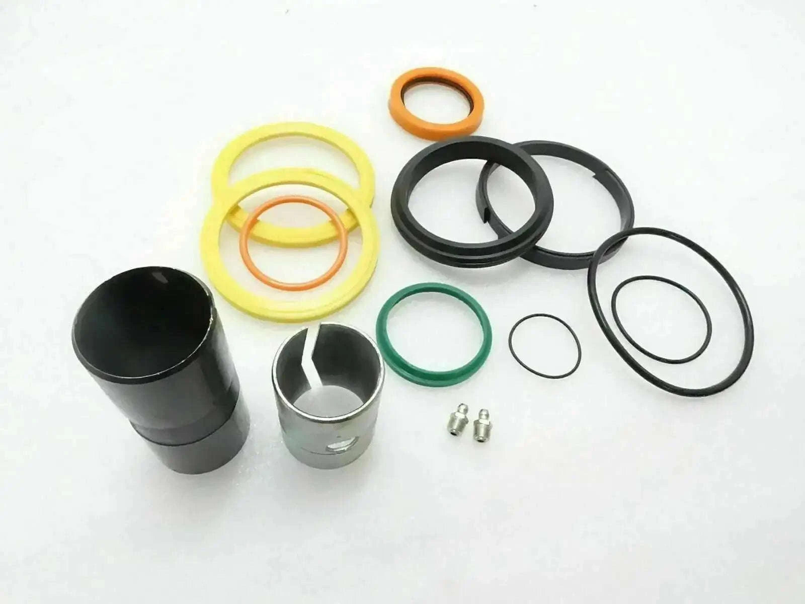Hydraulic boom ram repair kit with seal rings, O-rings, and metal pins