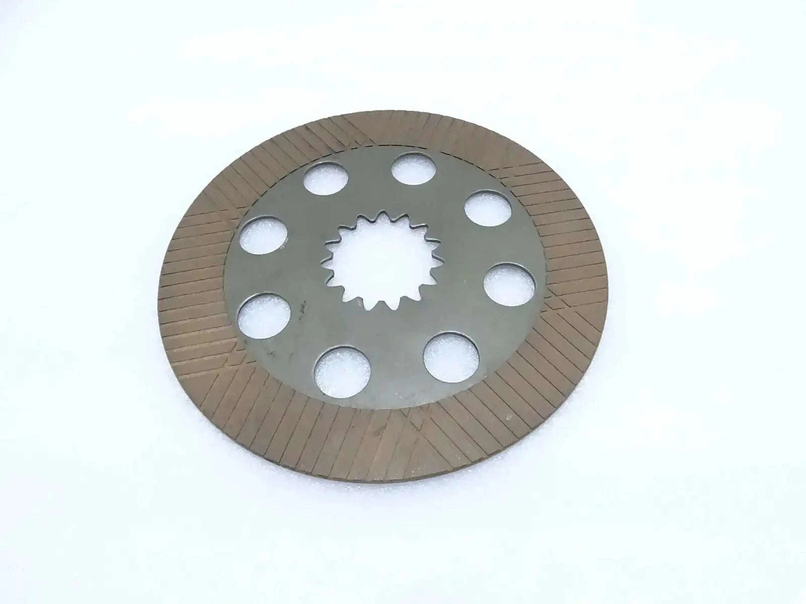 Brake friction plate with circular disc, six bolt holes, and toothed center