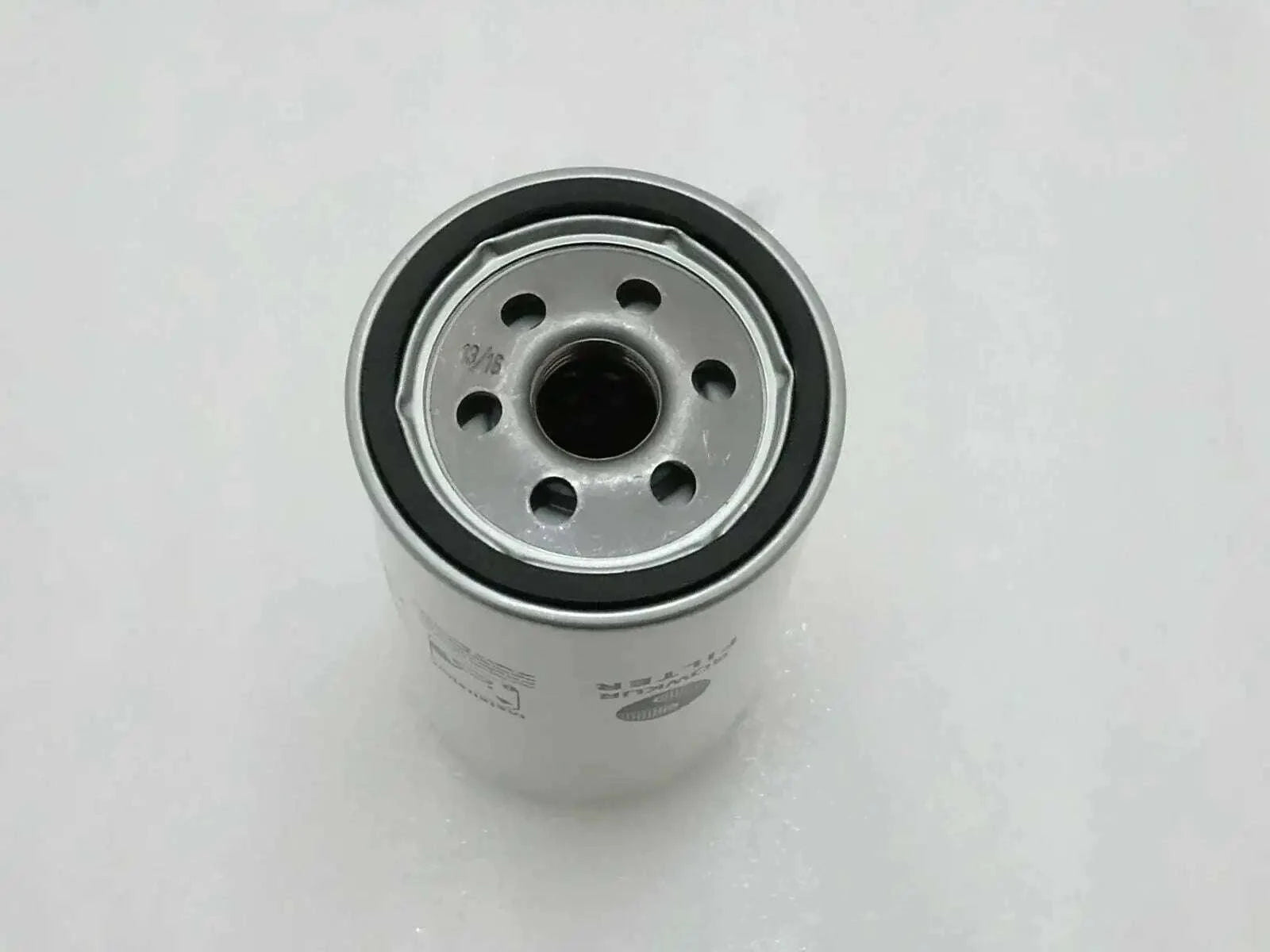 Hydraulic filter cartridge with metal end cap and center black seal