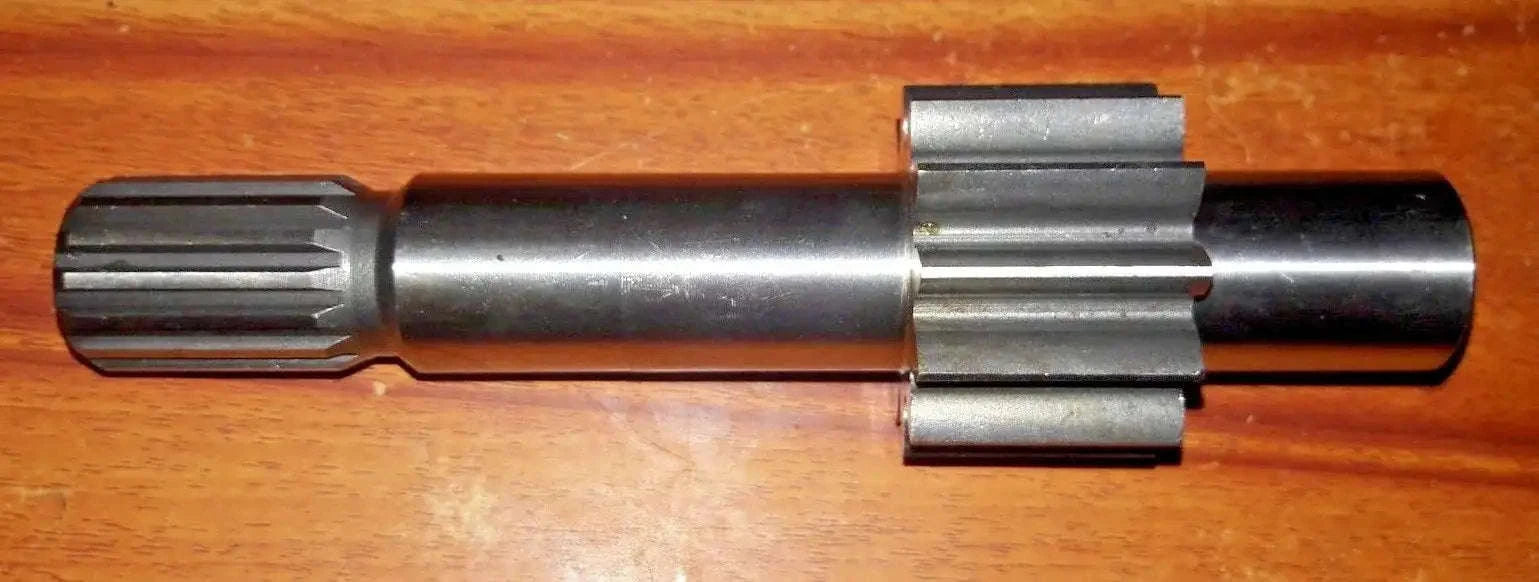 Hydraulic pump drive gear shaft with splined ends and metal coupling