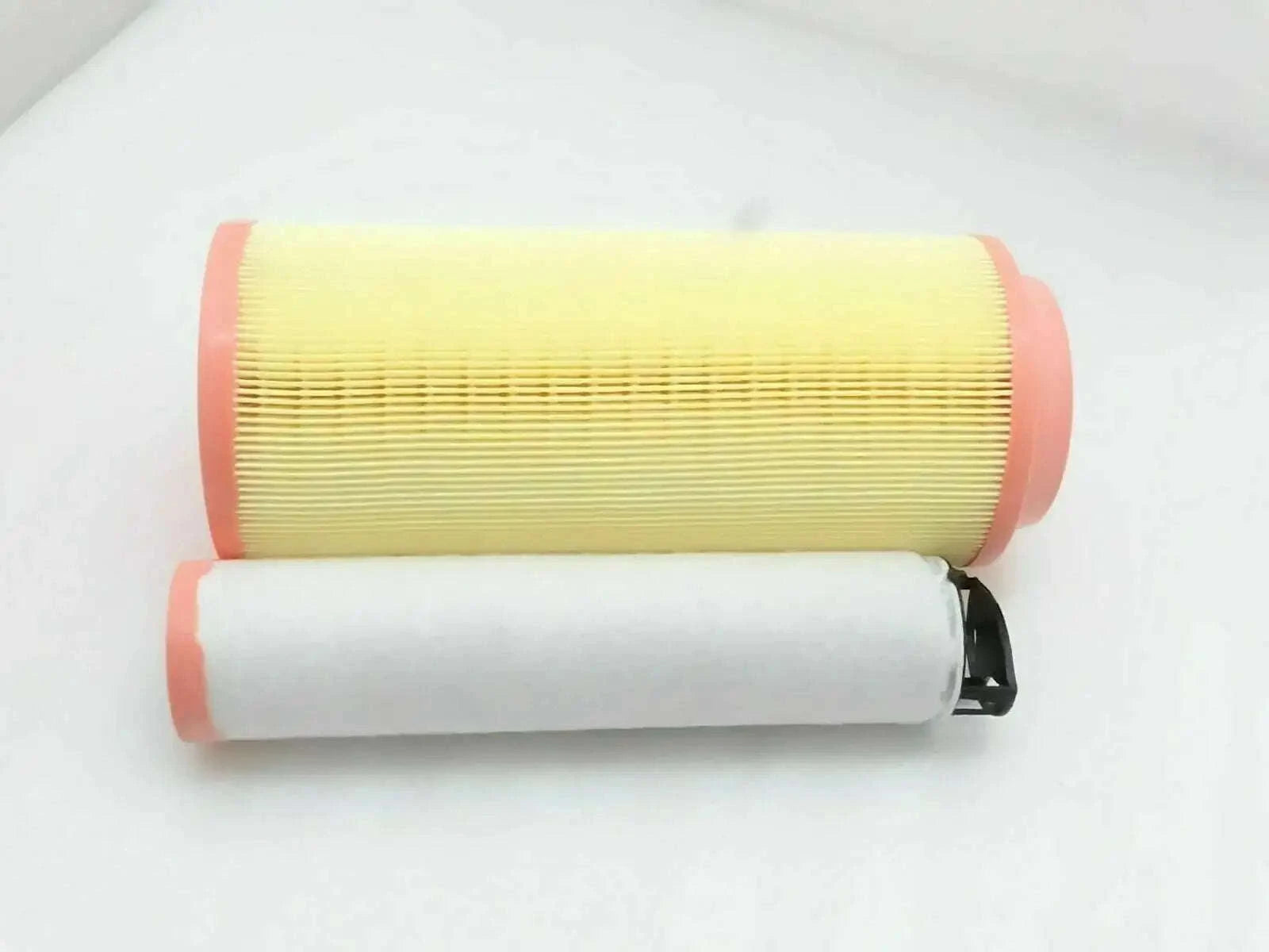 Air filter element with pleated yellow filter media and red end caps