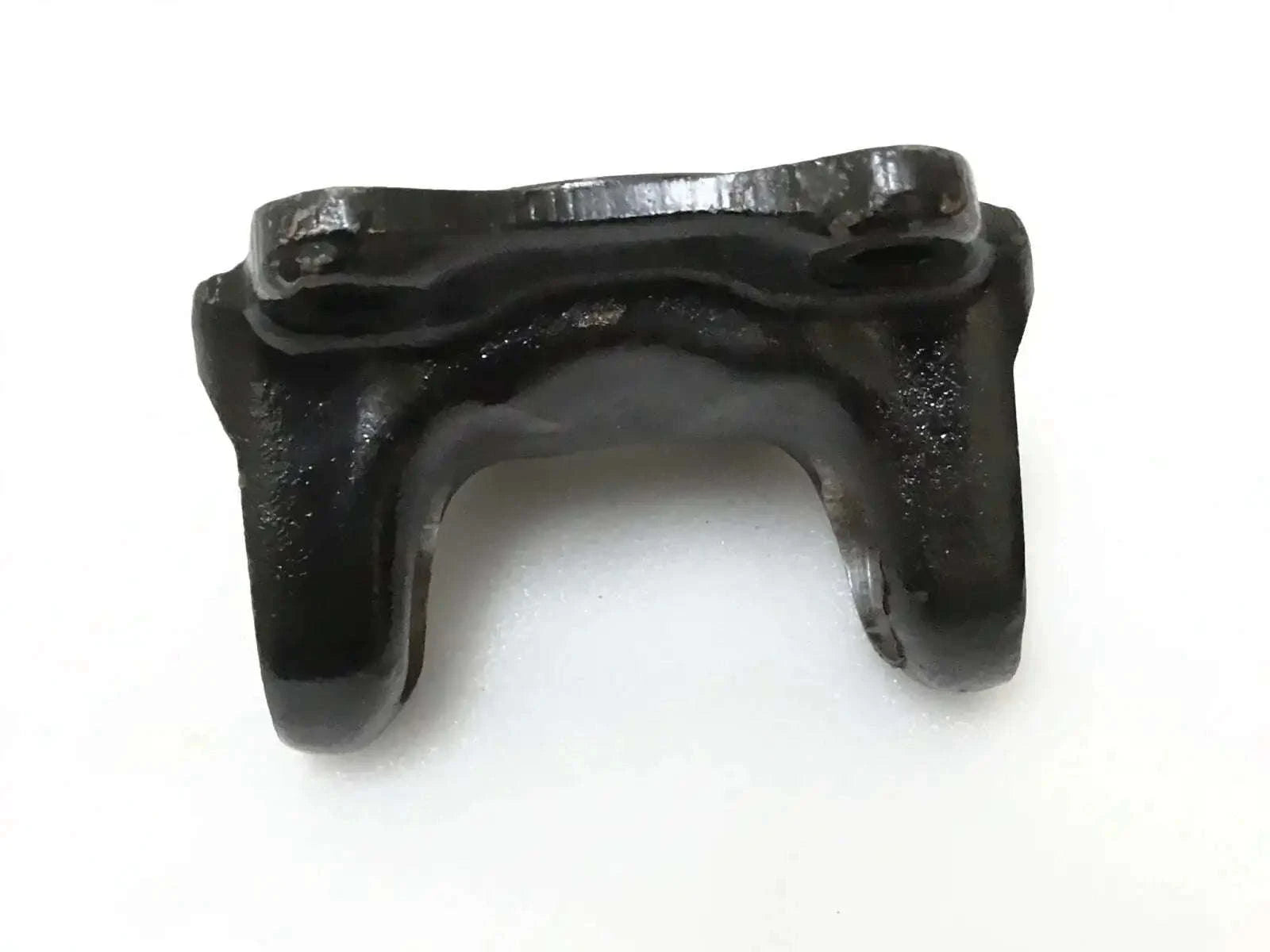 Metal flange yoke bracket with U-shaped opening and mounting tabs