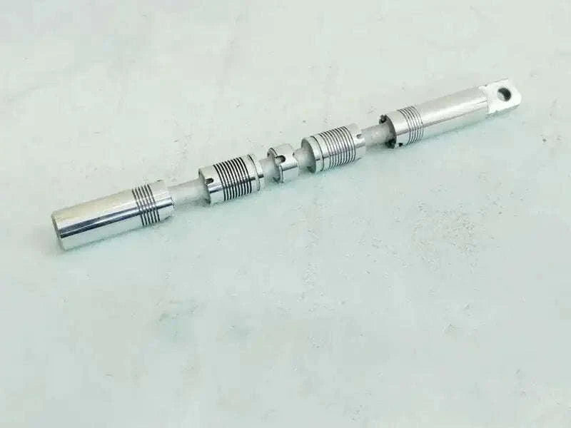 Hydraulic spool valve assembly with metal shaft and stepped spool body