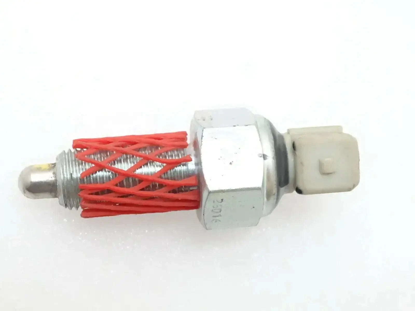 Metal hand brake switch with red wire coil and white plastic connector