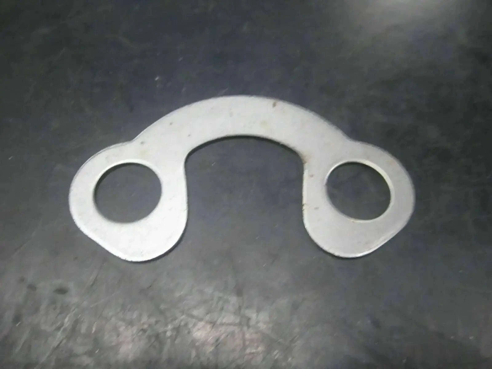 Silver metal tab washer with two holes, part 988/00055