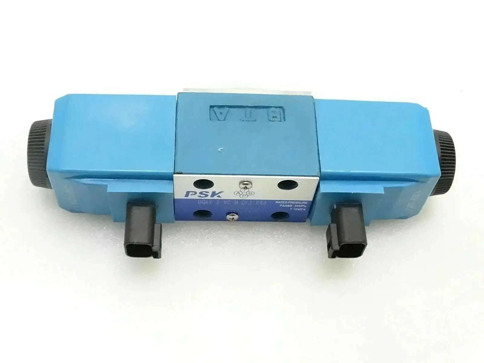 Blue valve solenoid with two front ports and black mounting blocks
