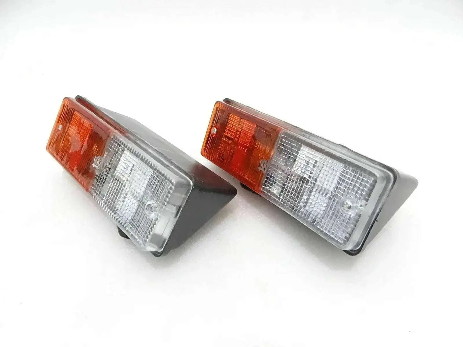 Pair of rear parking light assemblies with amber and clear rectangular lenses