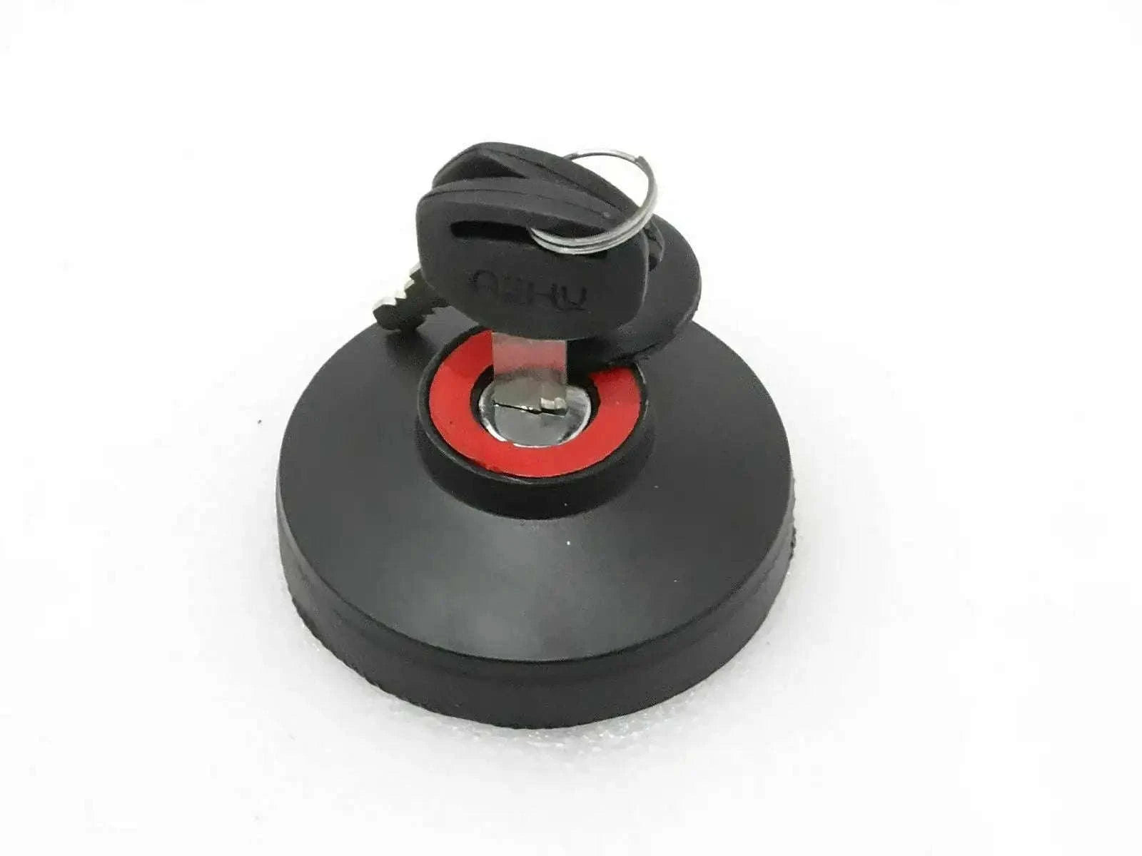 Black locking fuel tank cap with red seal and keys