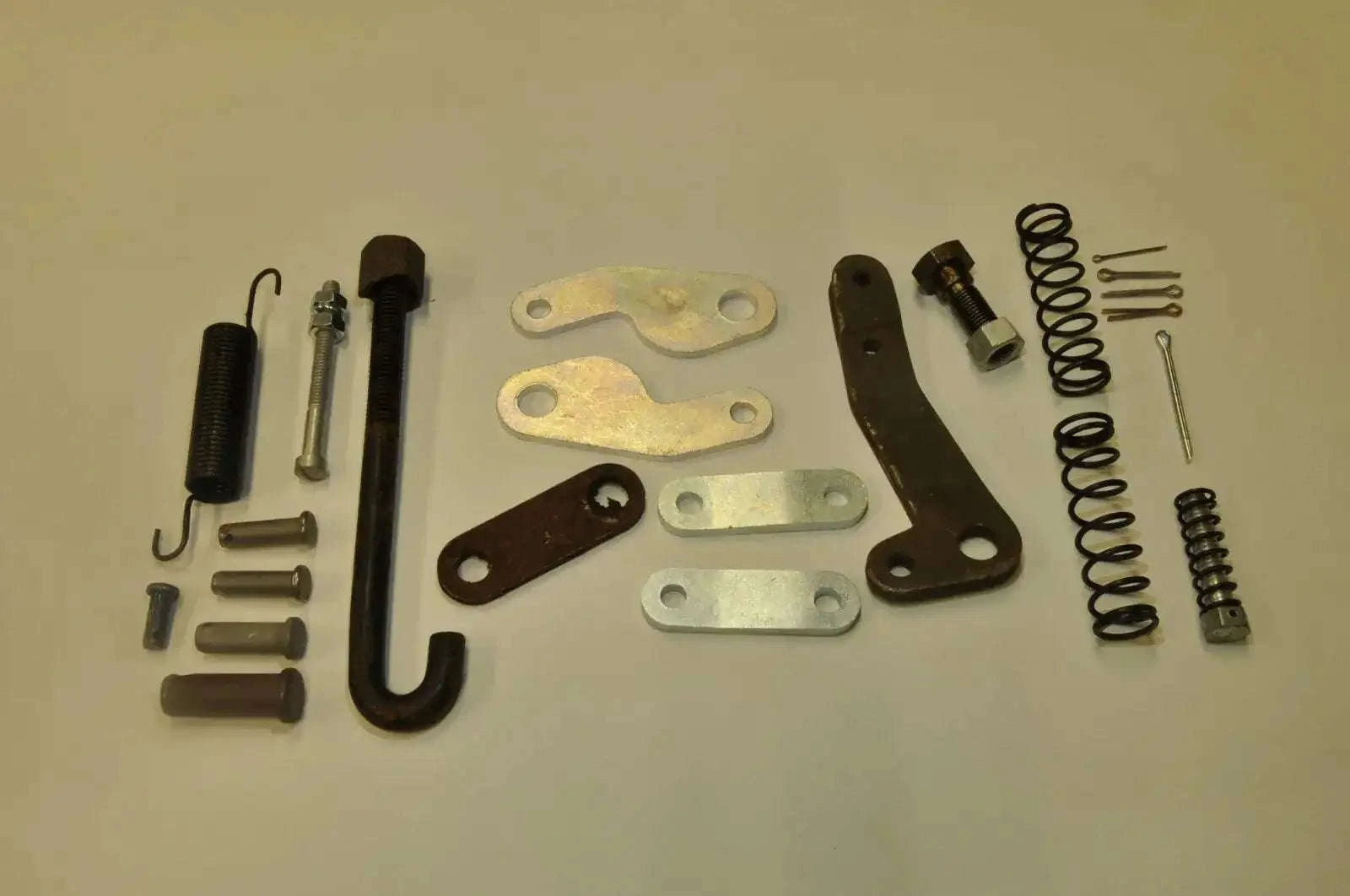Brake handbrake mounting hardware kit with brackets, springs, bolts, and pins