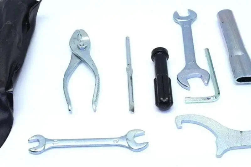 KTM Duke tool kit with various steel tools for motorcycle maintenance including wrenches and pliers