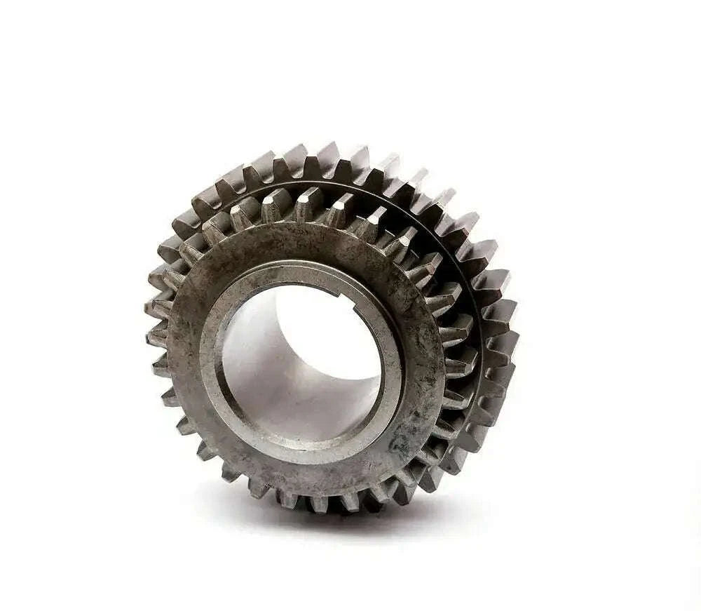 Metal tractor gear wheel with interlocking teeth and central bore