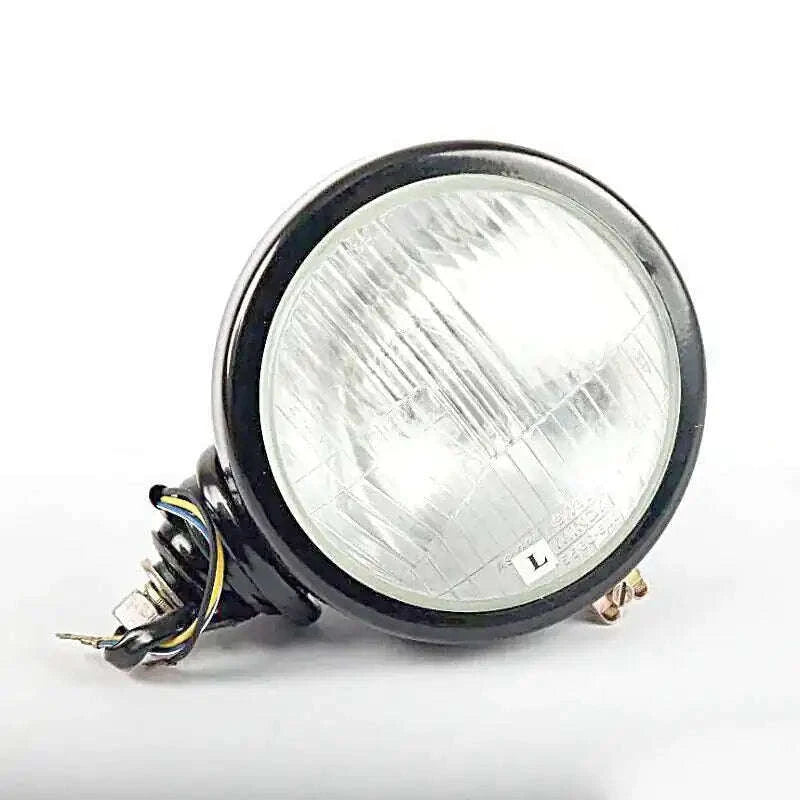Left tractor head lamp with clear round lens and wire connector