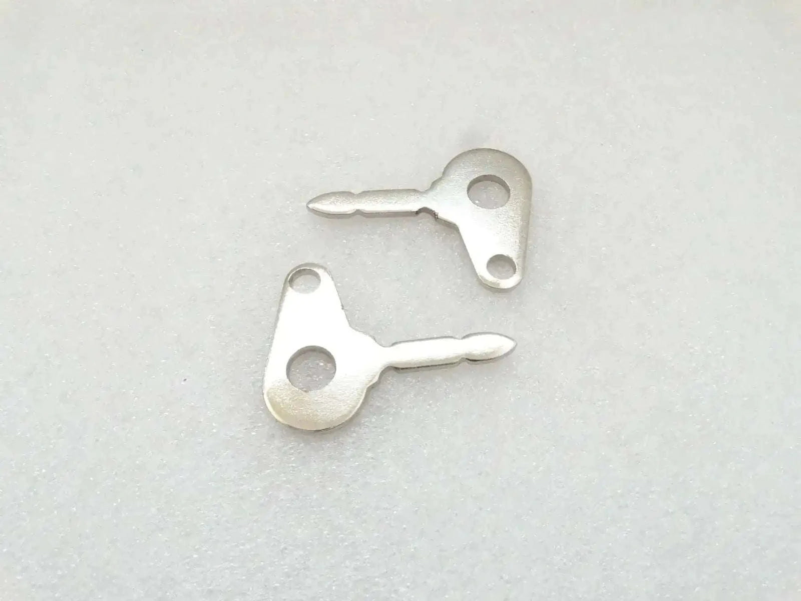 Ignition key blanks, two silver metal pieces