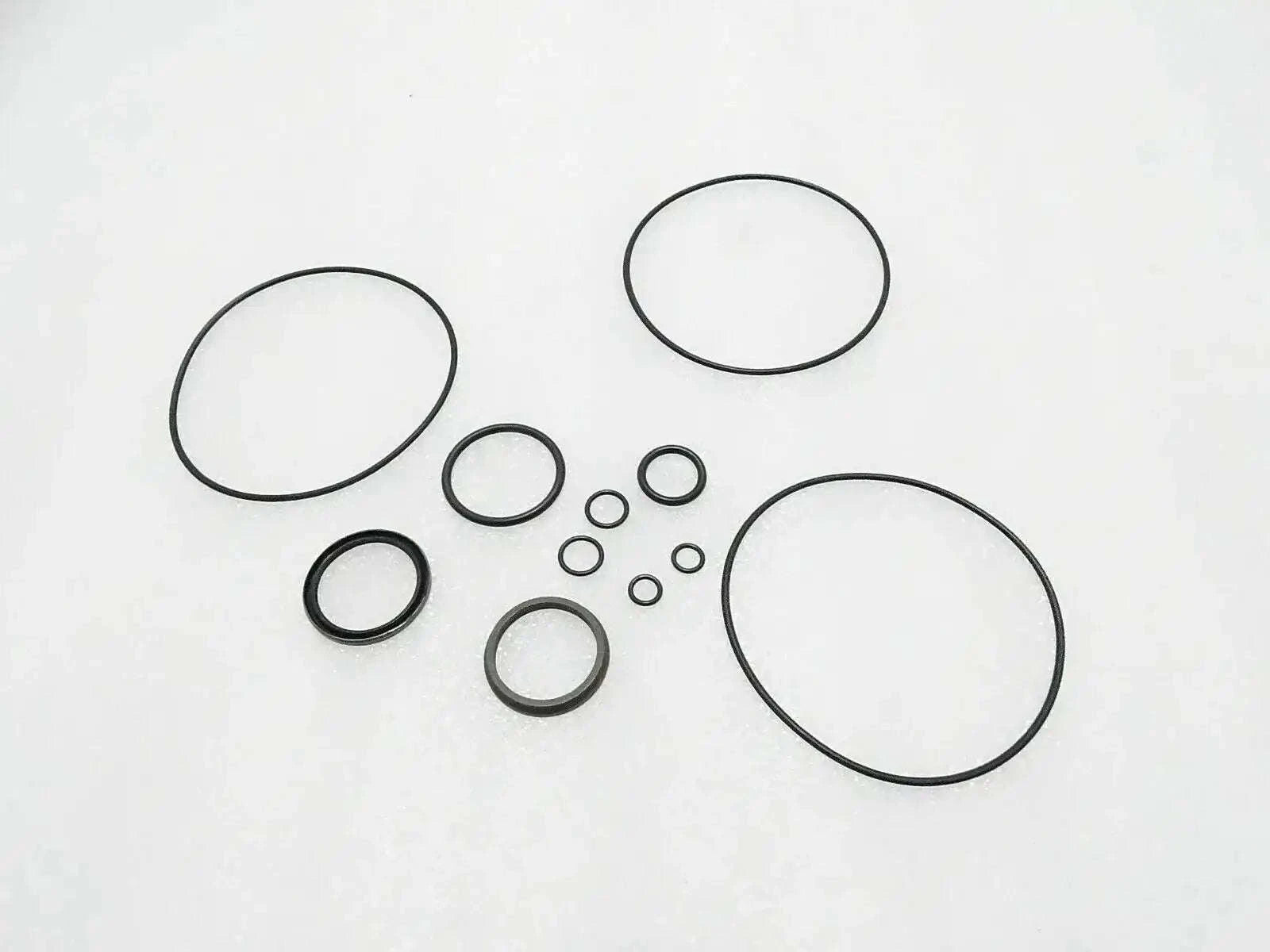 Tractor steering control unit seal kit with multiple circular gaskets and O-rings