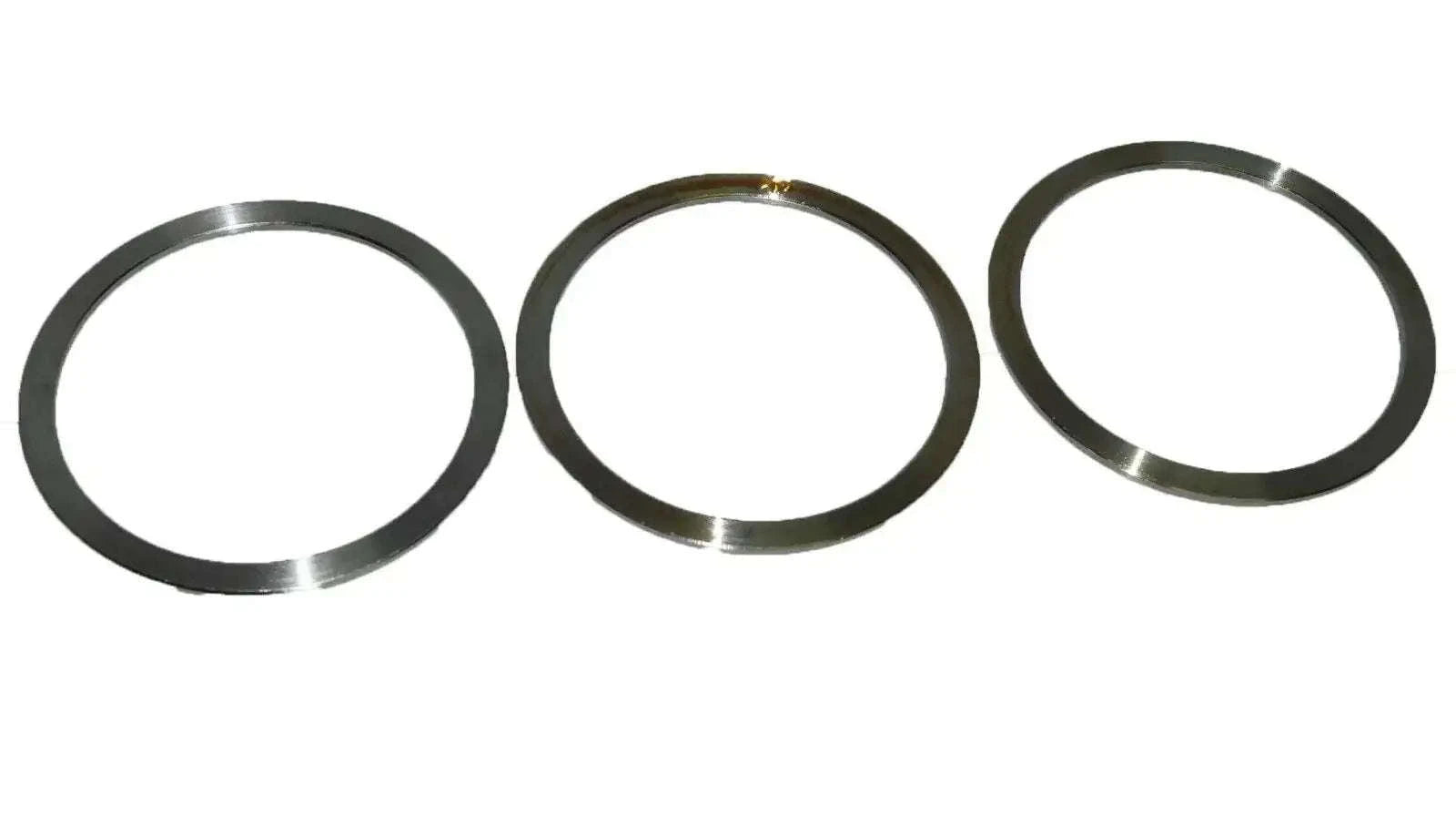 Set of three circular metal seal flange rings, dark gray