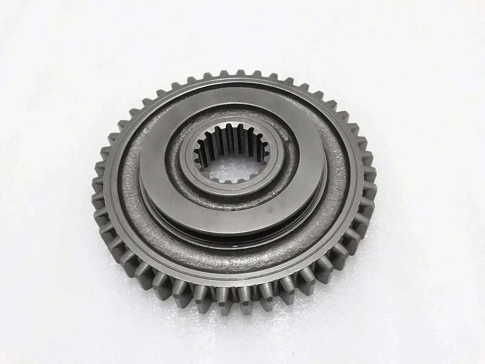 Metal spur gear with central splined hub and raised teeth