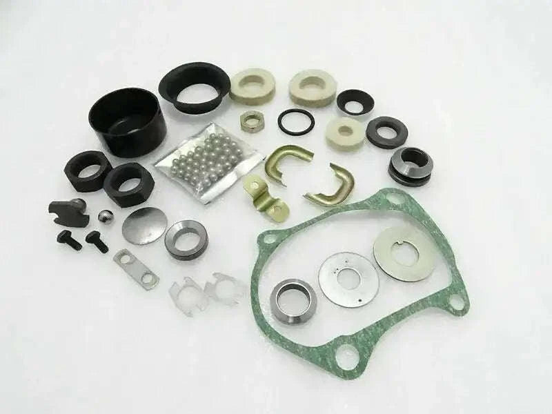 Steering column repair kit with gasket, bushings, washers, and seals in a set