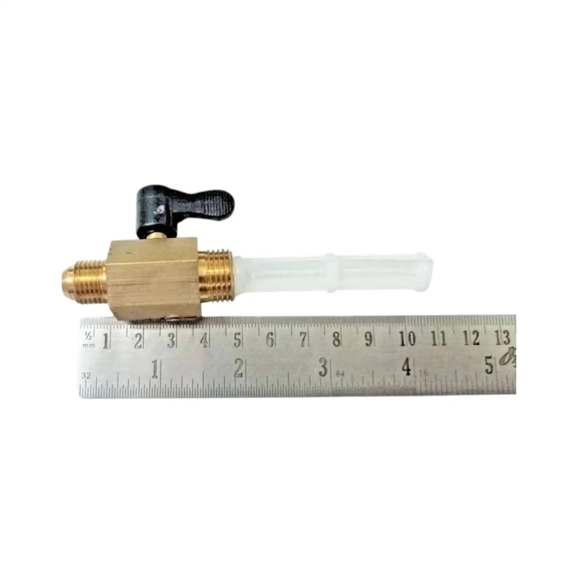 Brass fuel tap switch with black lever and white outlet, sized with measuring ruler