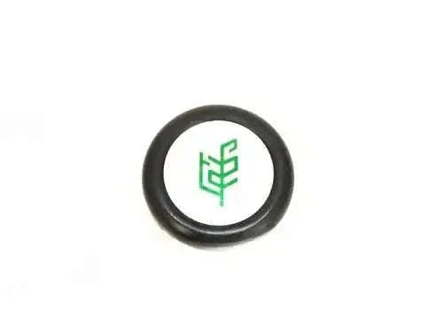 Black steering wheel cap with green Tafe logo on cream center