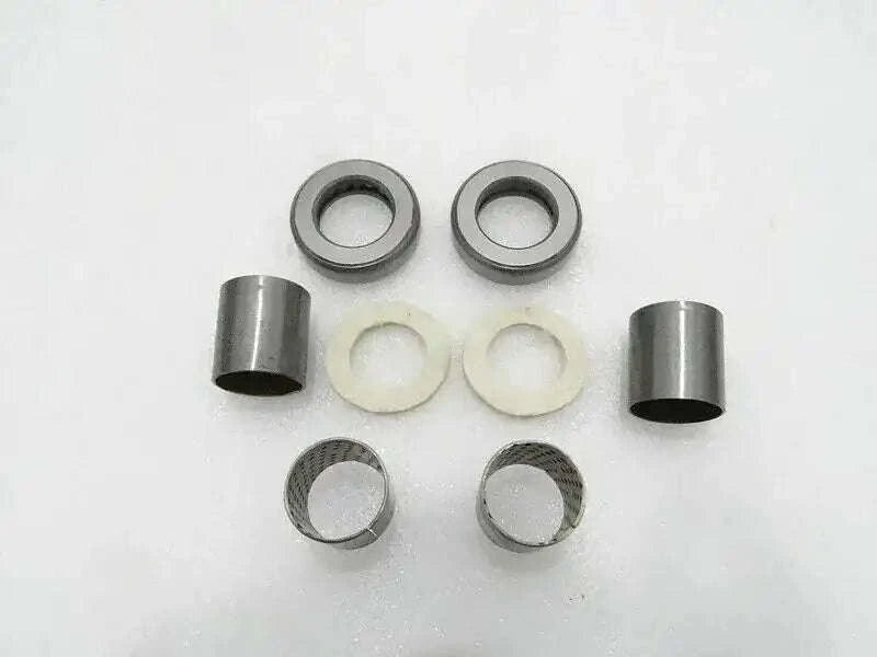 Tractor spindle kit with metal sleeves and washers