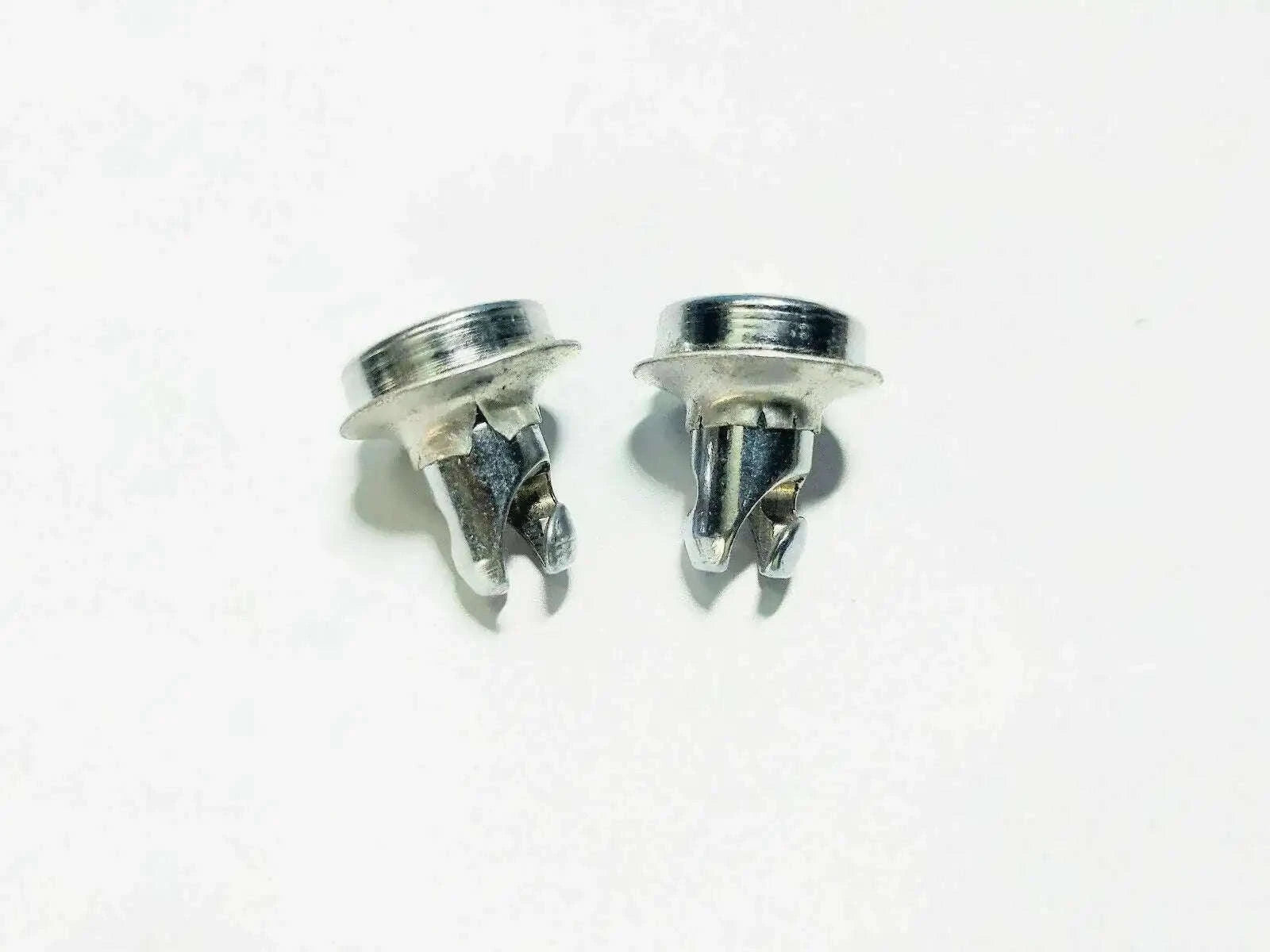 Pair of metal tractor front grill fasteners with threaded studs and spring clips