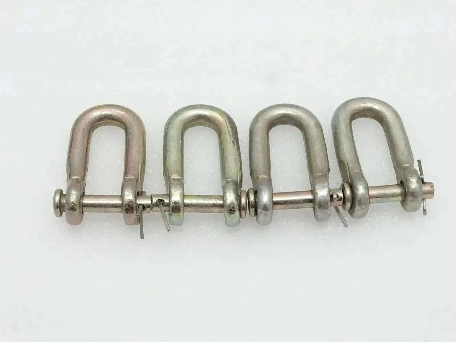 Set of four metal D-shackle chain links with locking pins, silver-gray