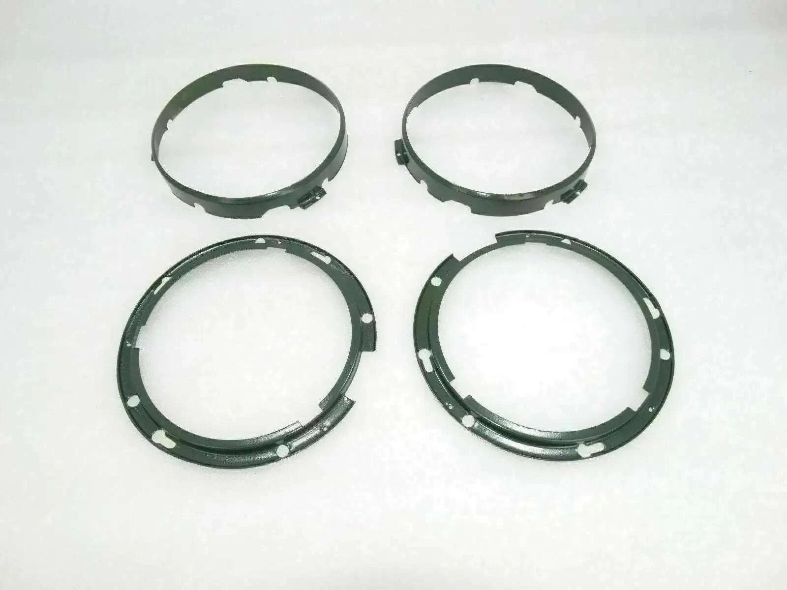 Headlight inner rim set with four dark circular rings and mounting holes