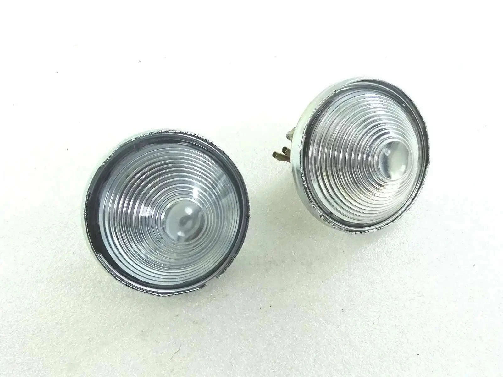 Pair of clear round parking/turn signal lenses with chrome bezels