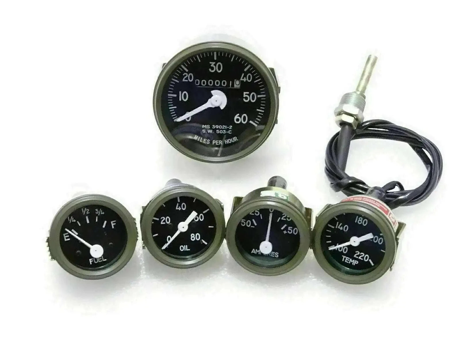 Green-bezel vehicle gauges set with speedometer, fuel, oil, temp, and amp meters