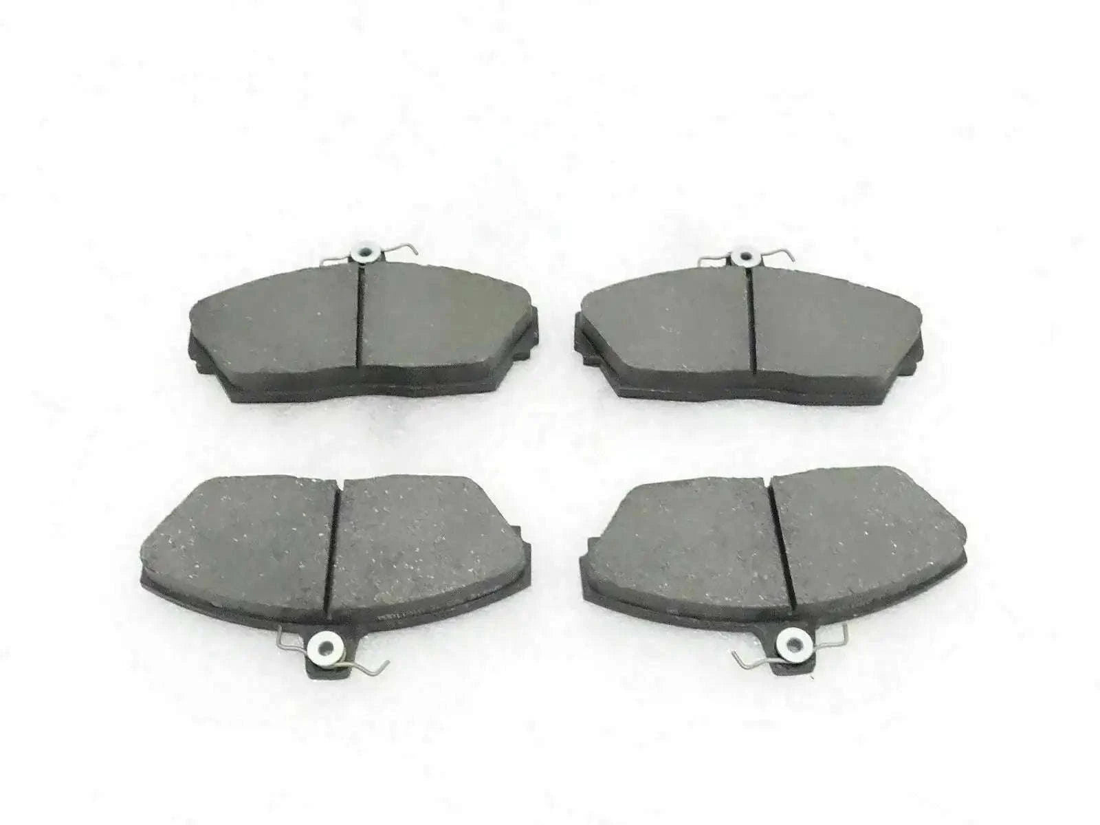 Disc brake pad set with four dark gray brake pads