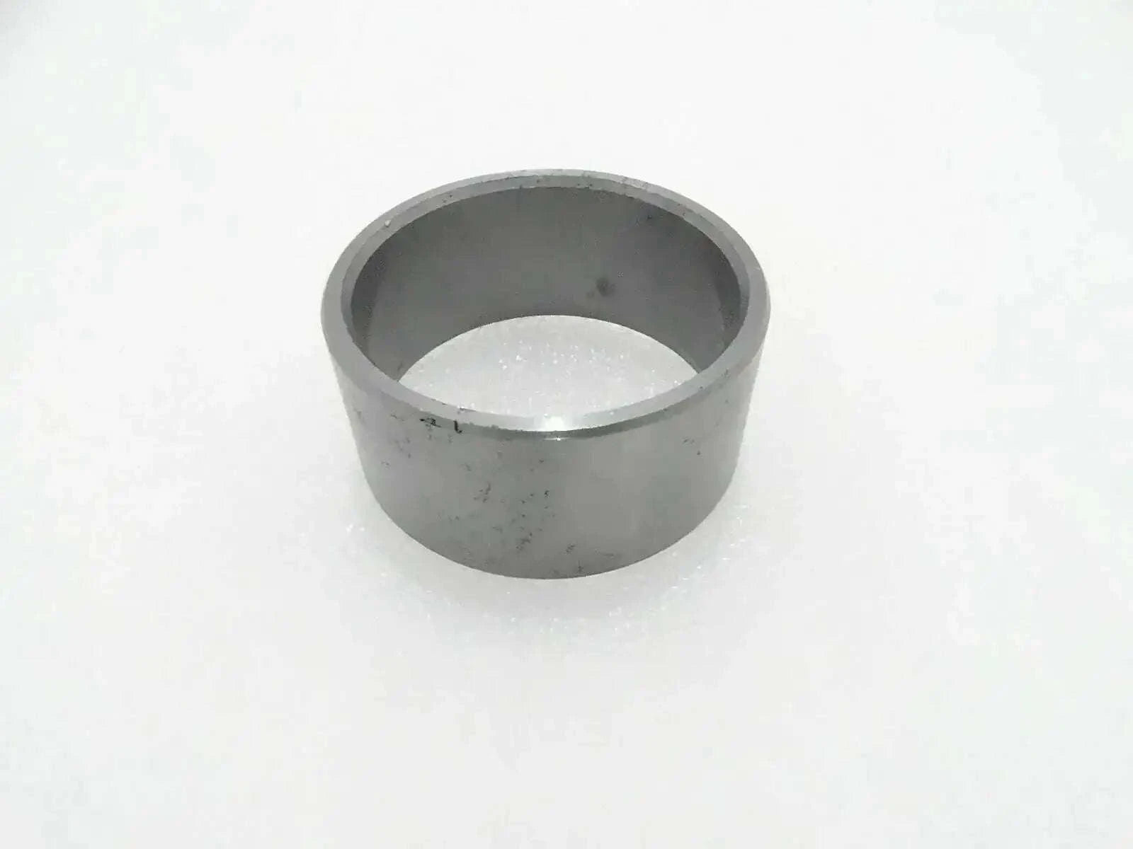 Gray metal inner bushing, cylindrical, open end.