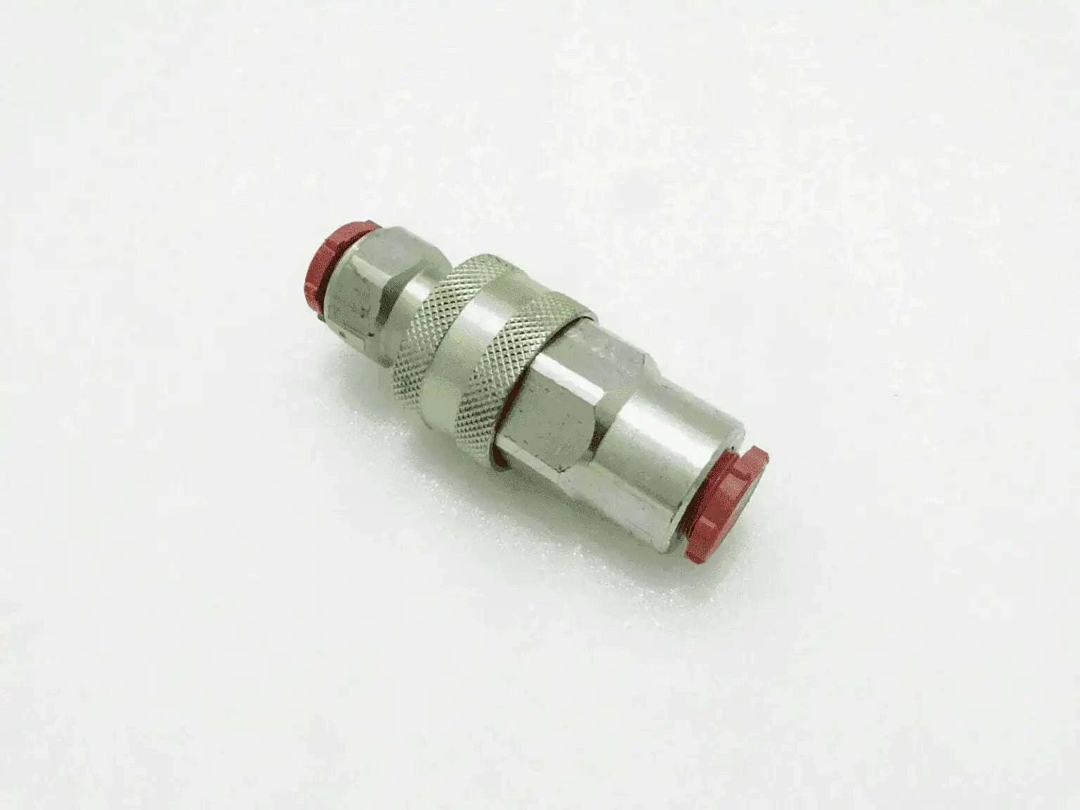 Hydraulic coupling fitting with red end seals, metal body