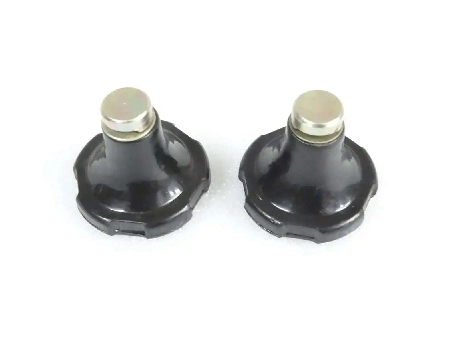 Pair of black hydraulic lift stop knobs with silver caps