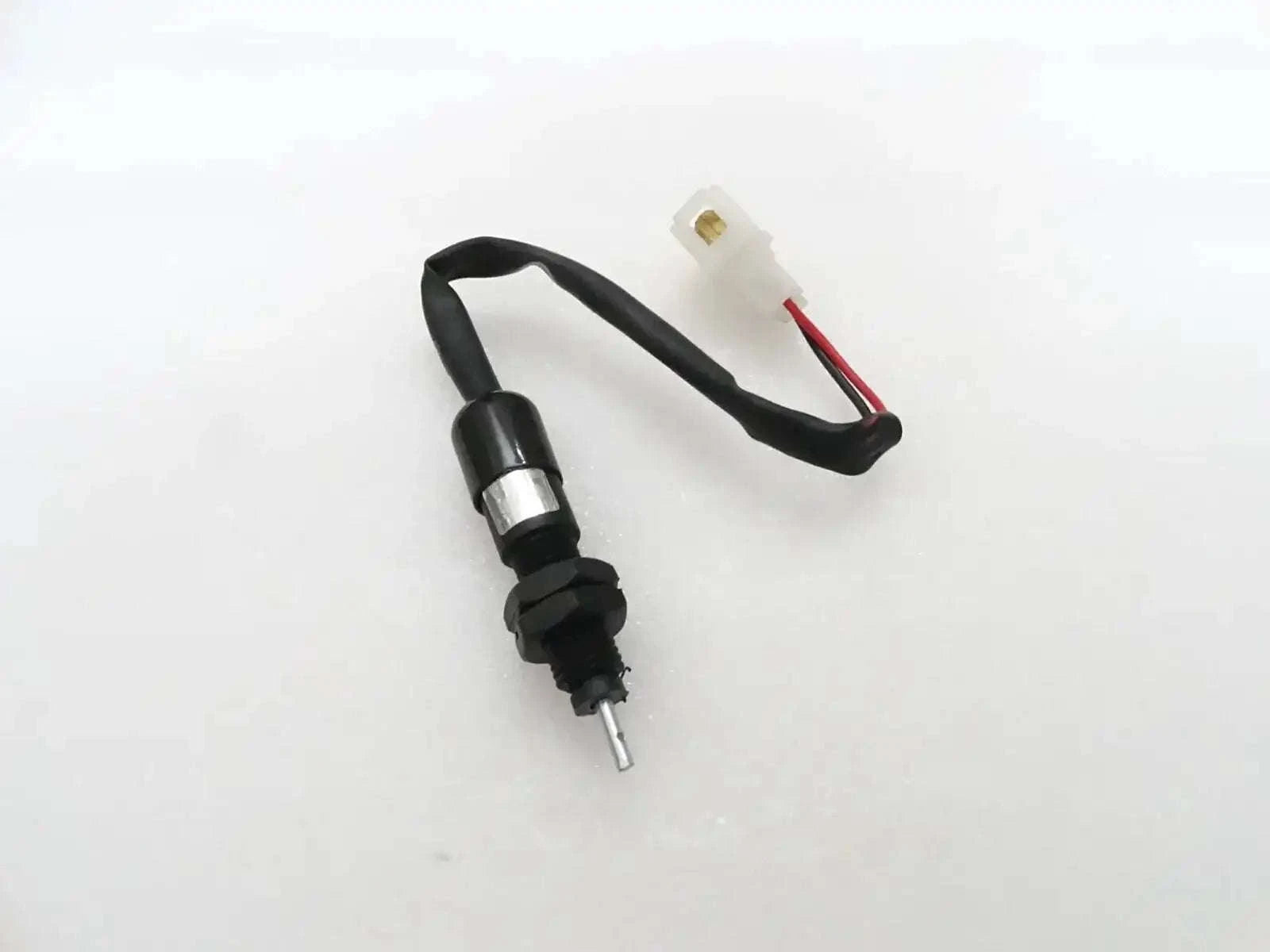 Tractor brake light switch with electrical coupler, black body and wire connector