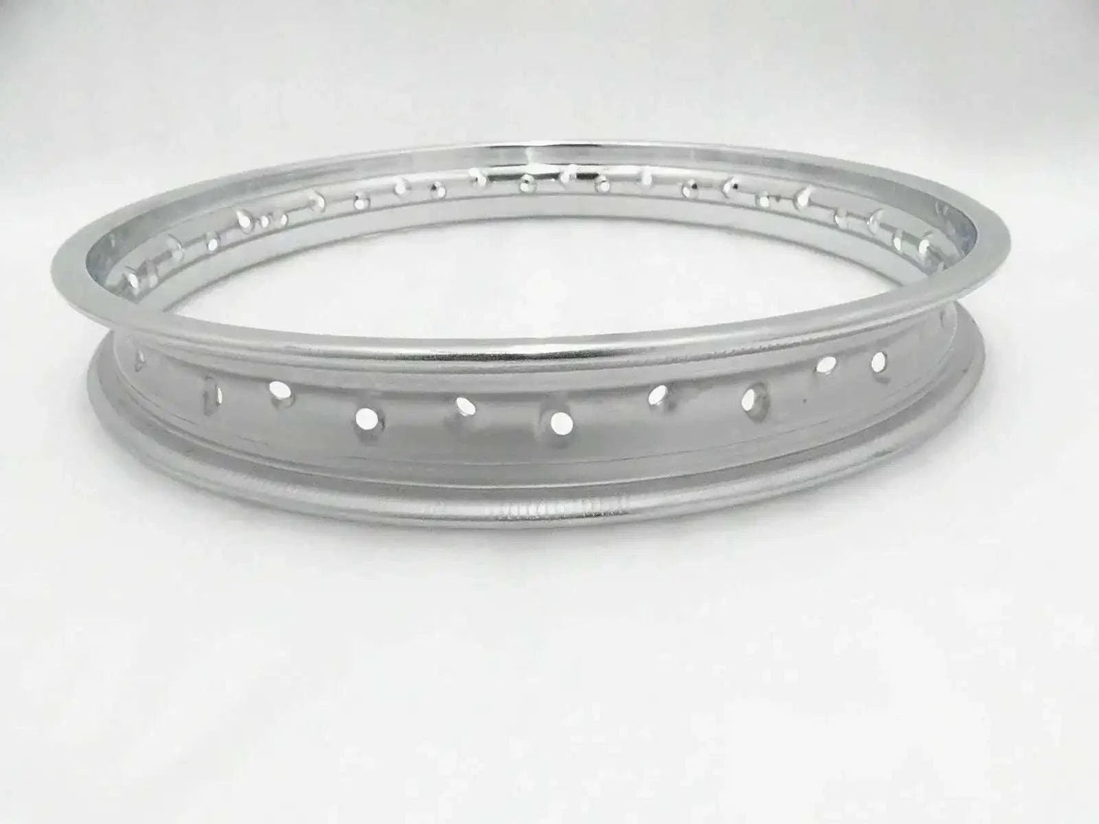 Steel motorcycle wheel rim with spoke holes, circular silver-gray