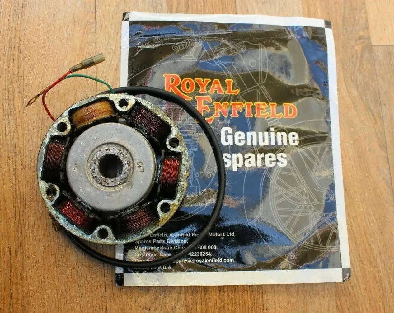 Royal Enfield alternator CDI assembly with circular metal stator and wire leads