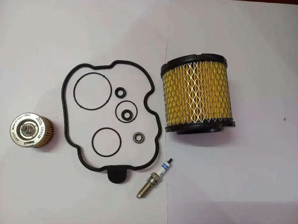 Motorcycle oil filter service kit with oil filter, gaskets, and fittings