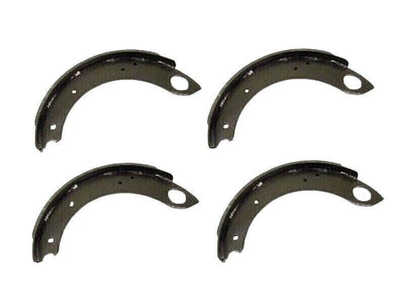 Set of four Ford 2600 brake shoes, durable steel material, designed for reliable tractor braking performance.