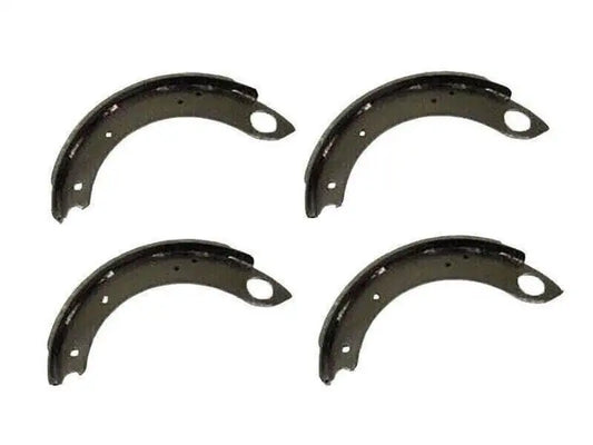 Set of four dark metal brake shoes with mounting holes