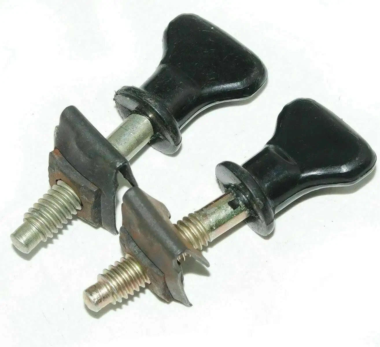 Front grille fastening knobs with black handles and metal studs