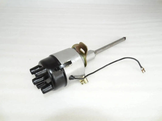 Complete distributor assembly with metal shaft, black housing, and wiring harness