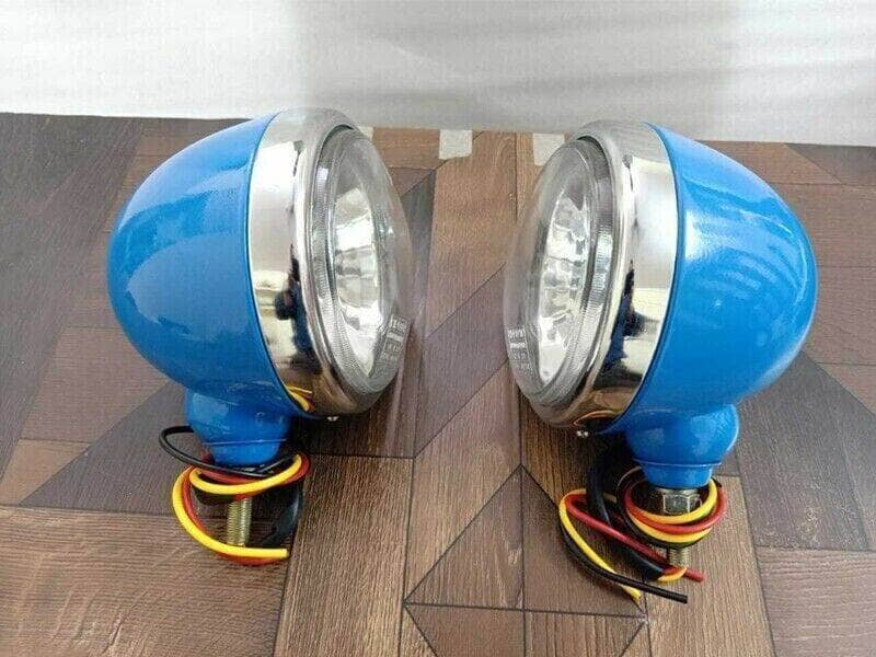 Ford tractor headlights set in blue with chrome accents and wiring attached