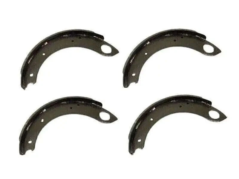 Set of four dark metal brake shoes with mounting holes