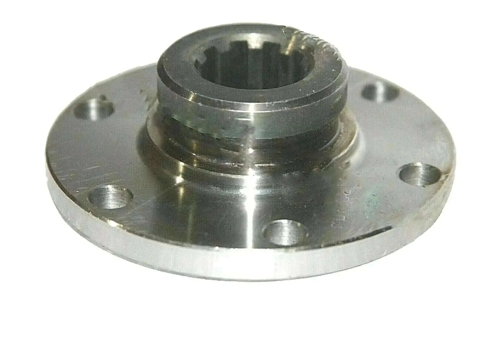 Front axle drive flange with central spline, four mounting holes, metal cog