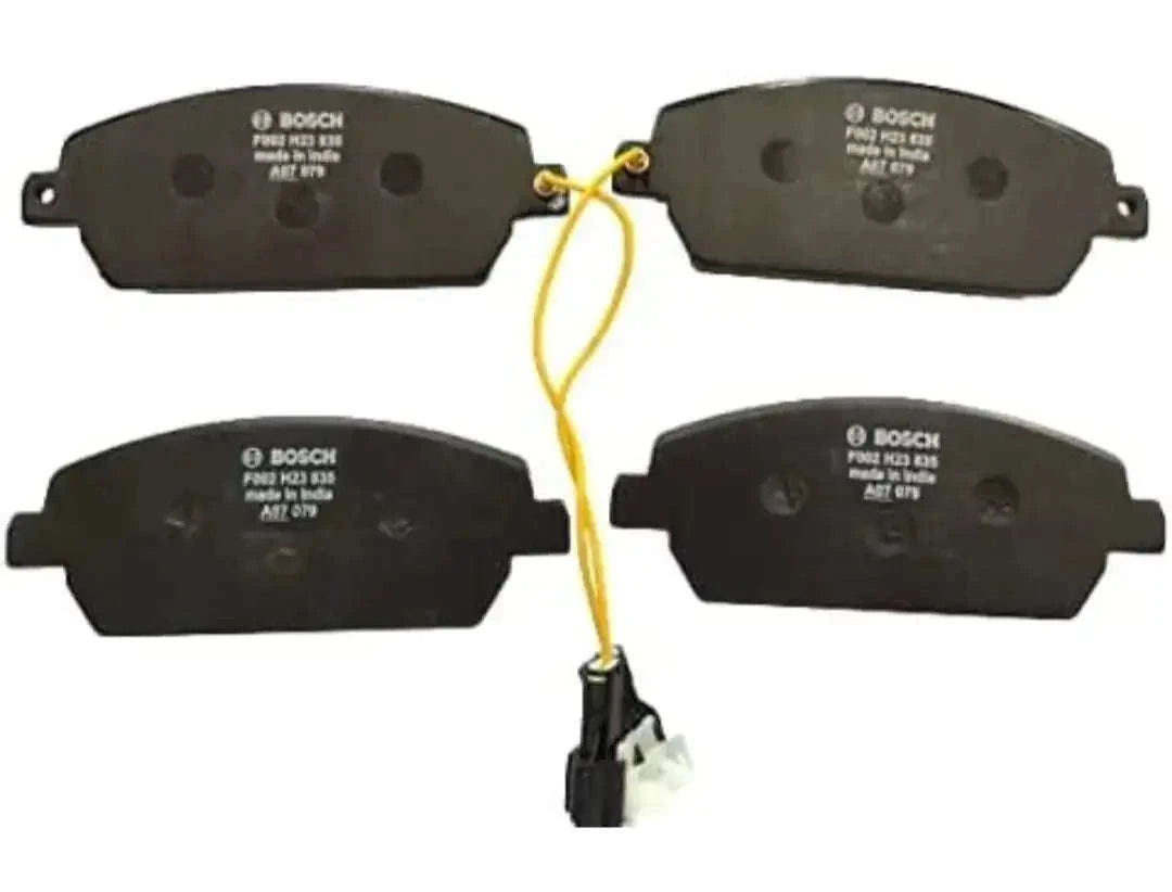 Bosch front brake pads set of four, black friction pads with wear markings