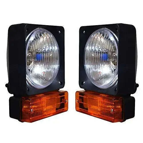 Pair of black headlight lamps with clear lens and amber indicator lights