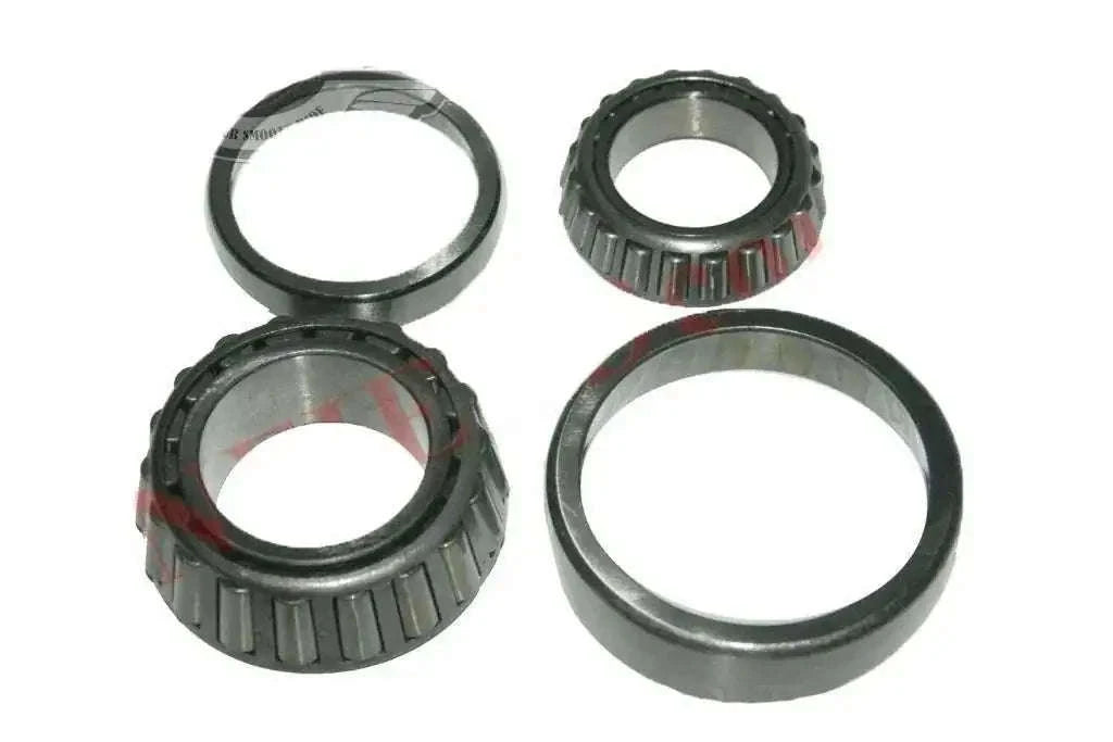 Front wheel bearing kit set with four metal bearing rings and roller assemblies