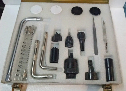 Common rail injector tools kit with metal wrenches, gauges, and injector adapter tips in case